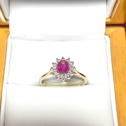 Oval Ruby And Diamond Cluster Ring in Yellow Gold