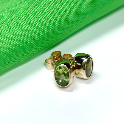 Oval Shaped Peridot Yellow Gold Stud Earrings