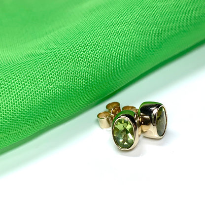 Oval Shaped Peridot Yellow Gold Stud Earrings