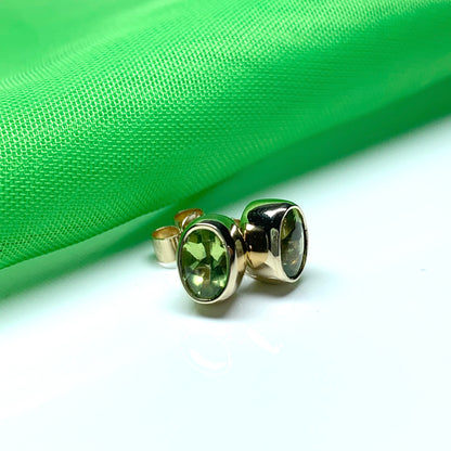 Oval Shaped Peridot Yellow Gold Stud Earrings