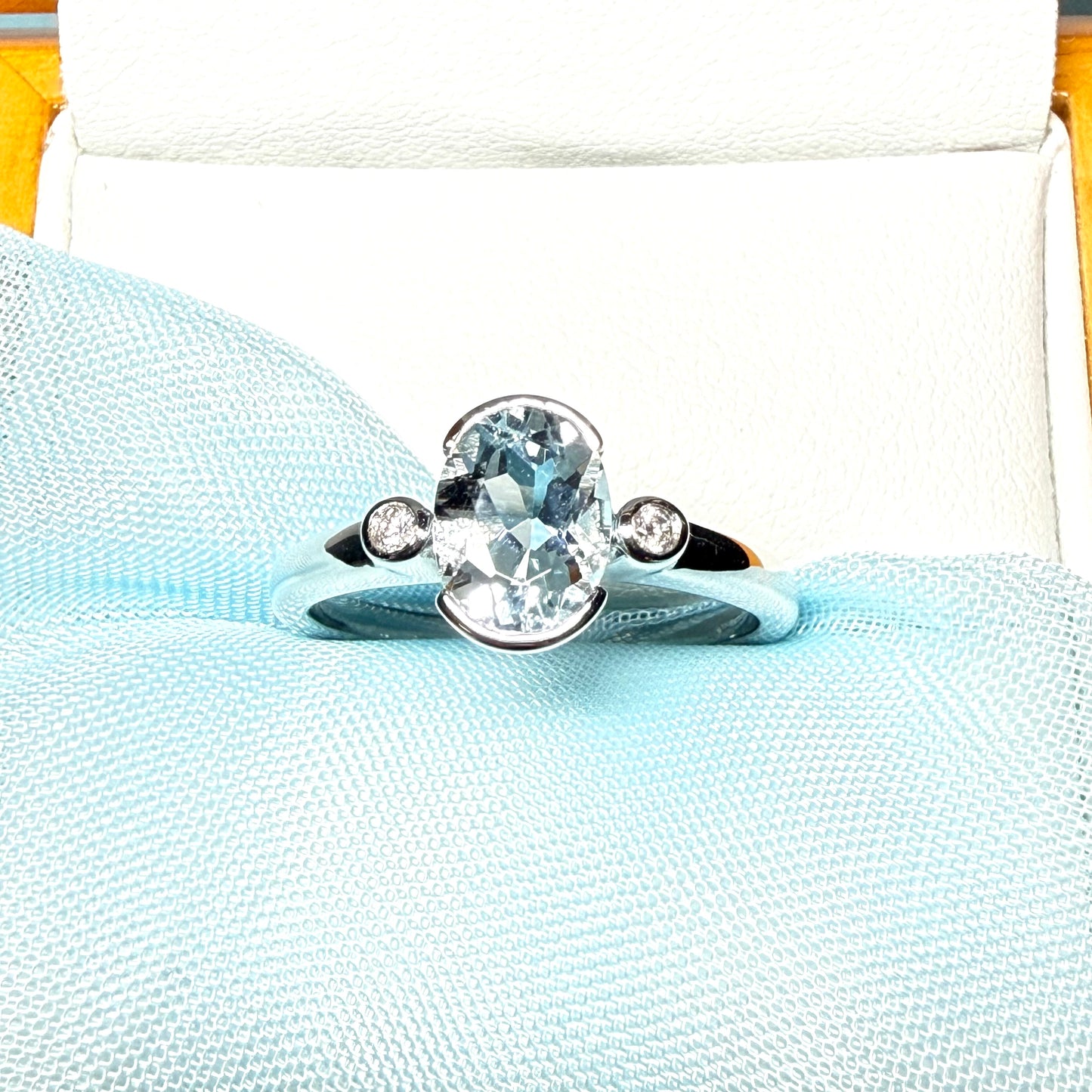 An oval real aquamarine ring and real round diamond white gold trilogy three stone dress, simply stunning