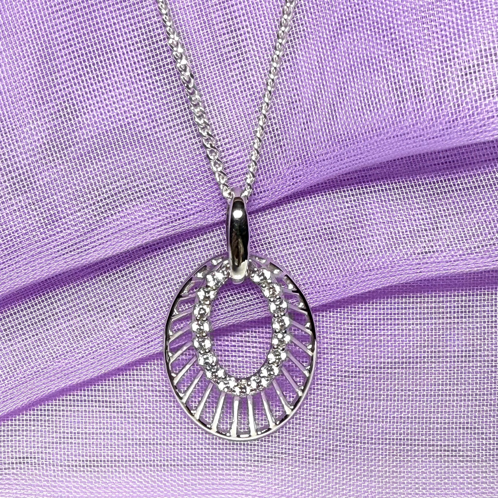 Oval shaped cubic zirconia sterling silver necklace with a chain