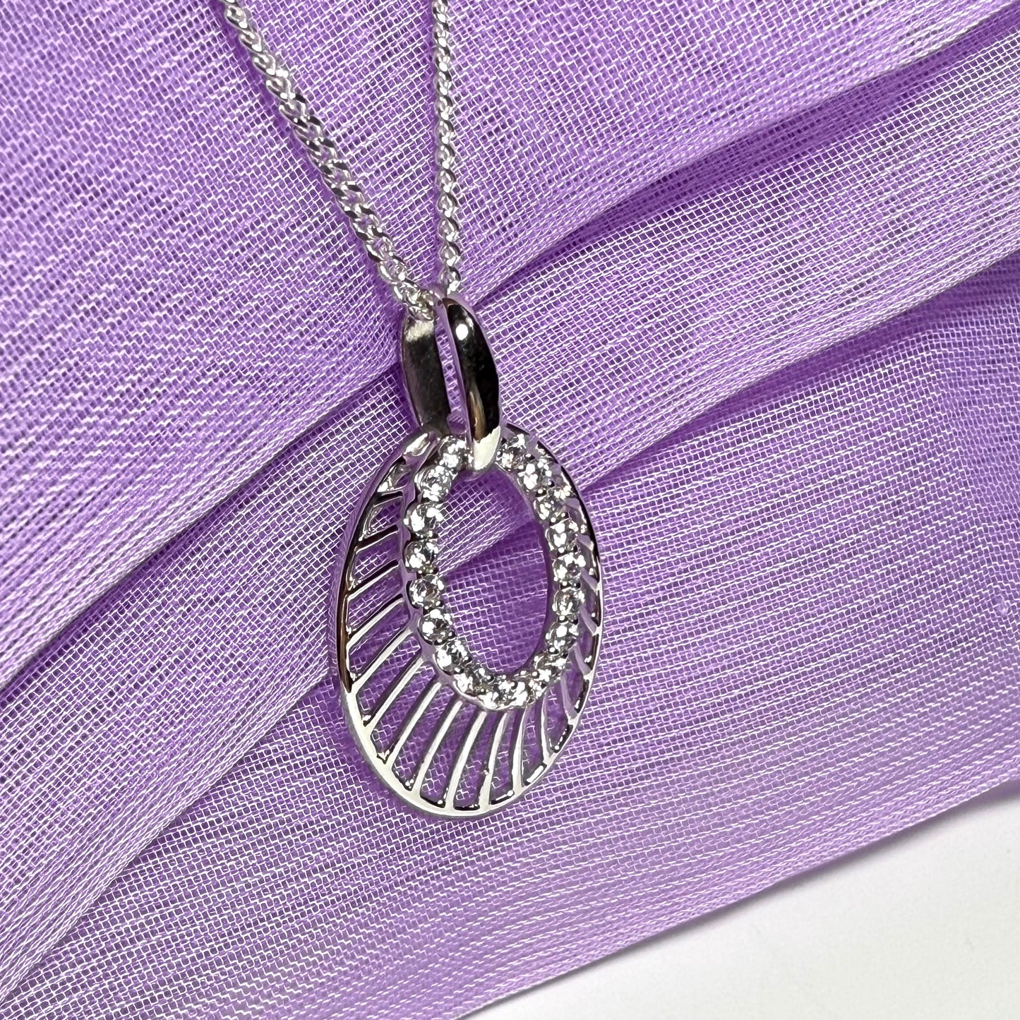 Oval shaped cubic zirconia sterling silver necklace with a chain