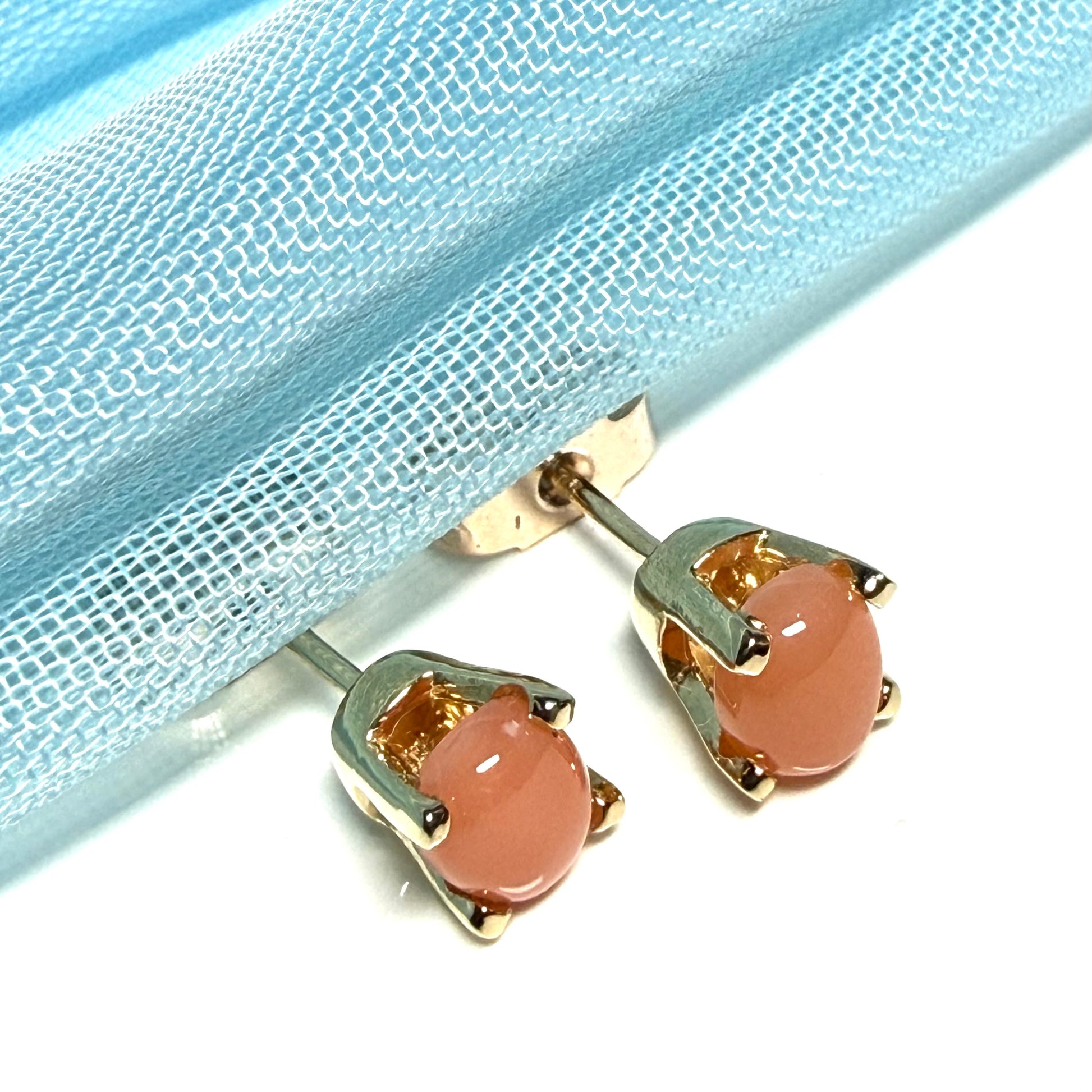 Oval shaped real coral stud earrings yellow gold four claw set
