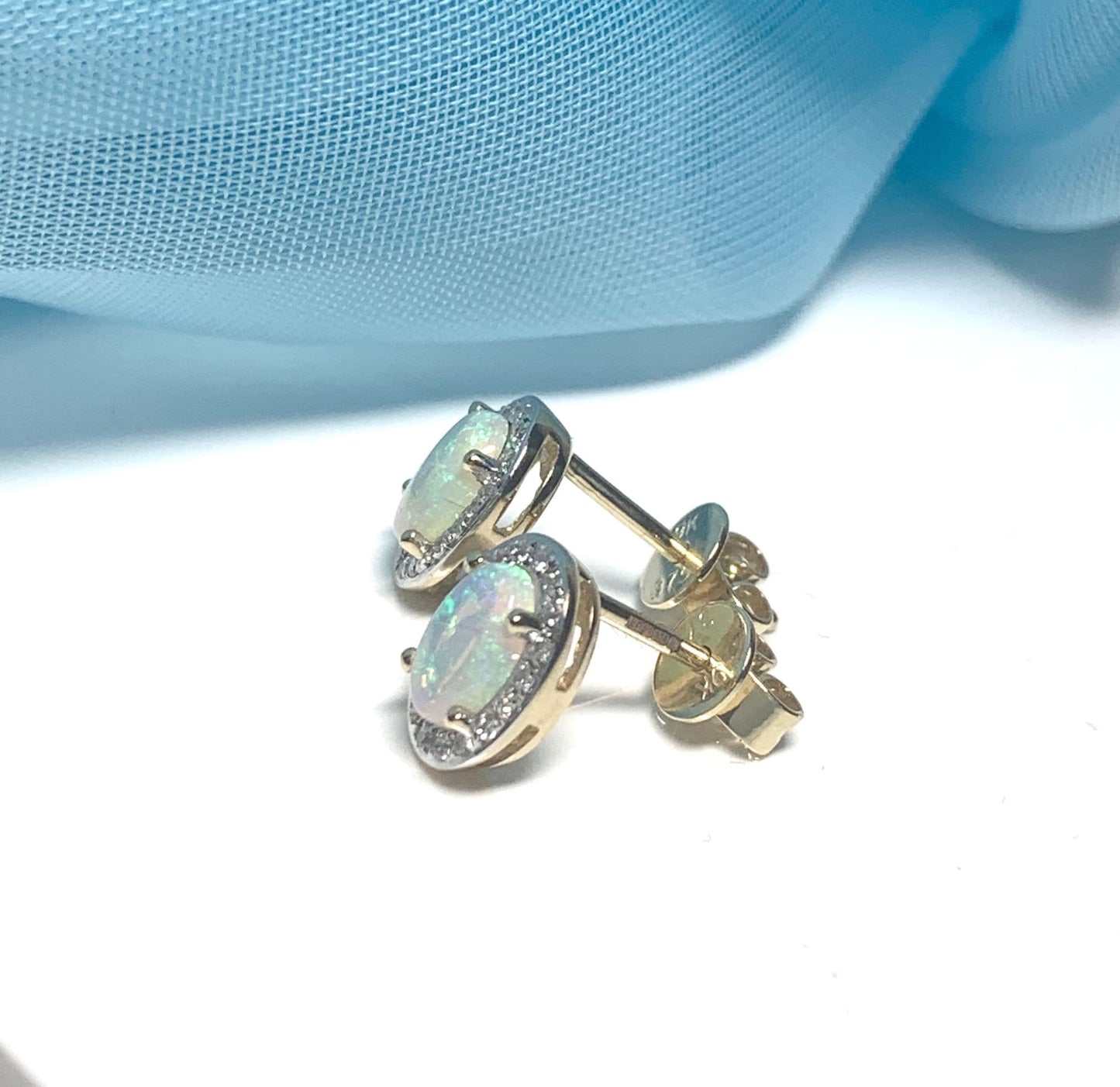 Oval opal and diamond yellow gold stud cluster earrings