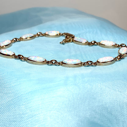 Oval opal yellow gold bracelet