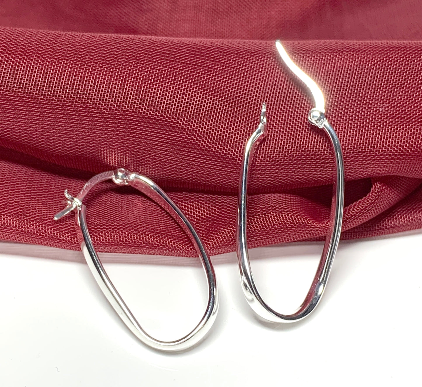 Oval twisted polished hoop earrings sterling silver