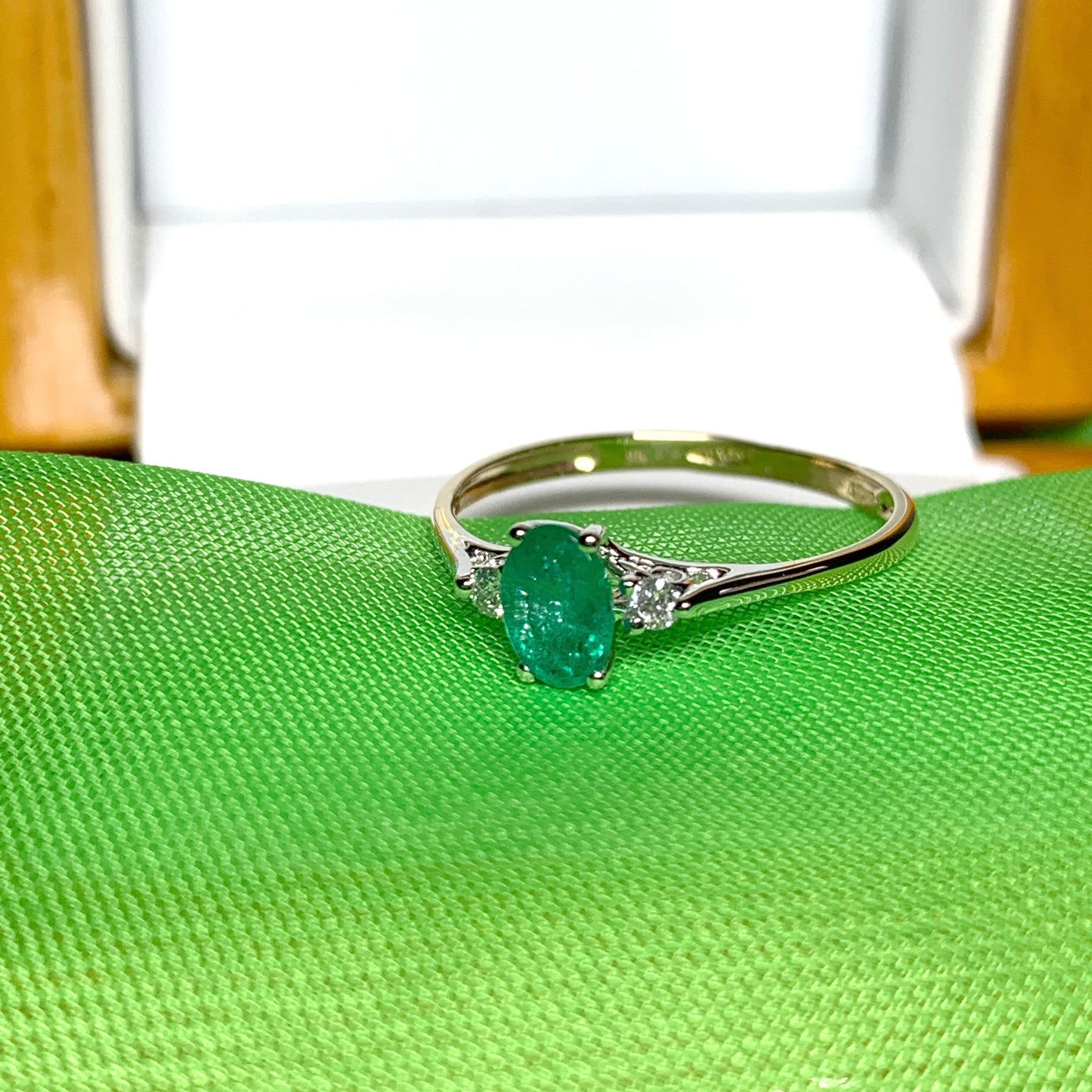 Oval real green emerald and diamond yellow gold trilogy dress ring