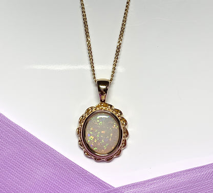 Oval real opal yellow gold necklace with a roped edge