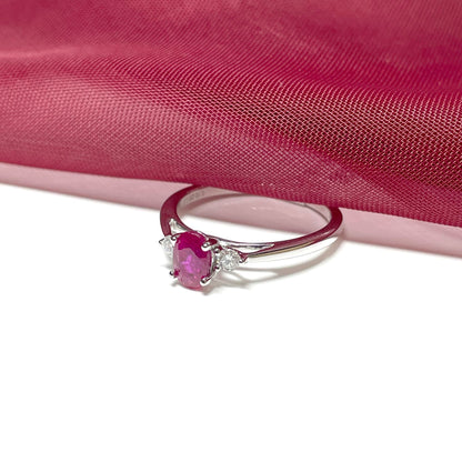 Oval ruby red and diamond white gold dress ring