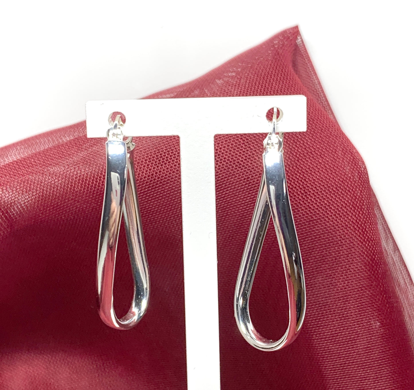 Oval twisted polished hoop earrings sterling silver