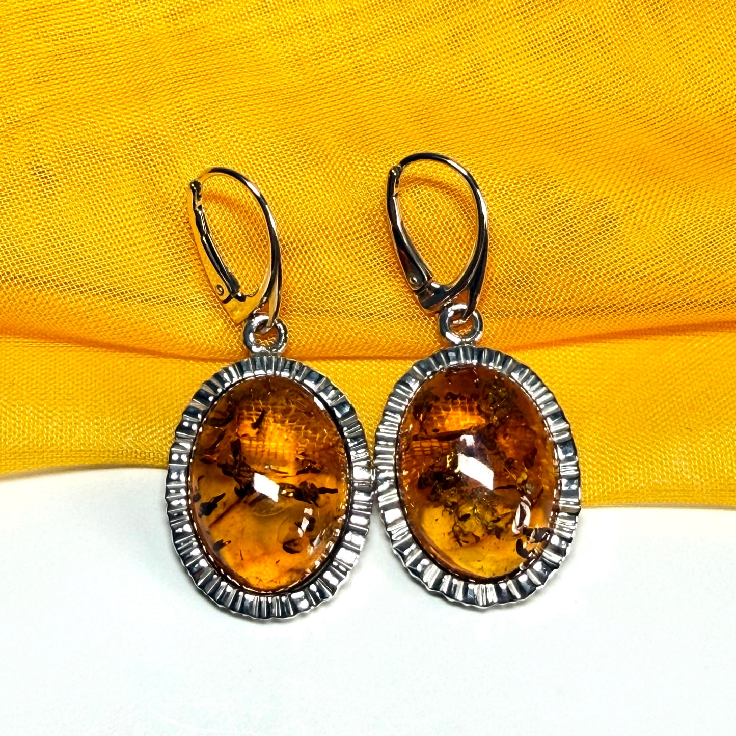 Pair of real amber drop earrings oval shaped sterling silver continental wire fastenings