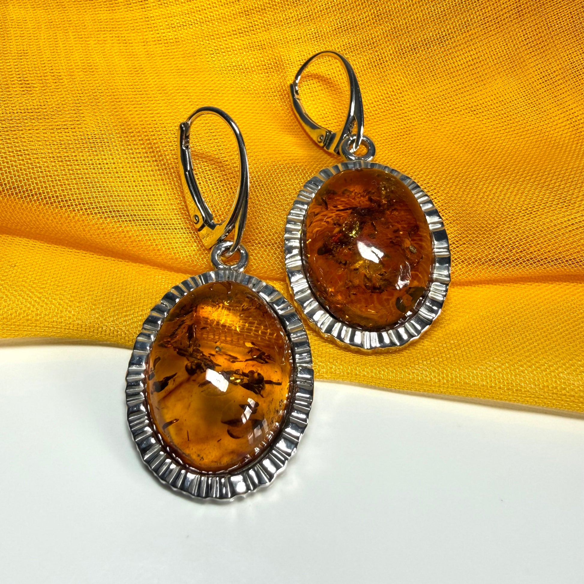 Pair of real amber drop earrings oval shaped sterling silver continental wire fastenings