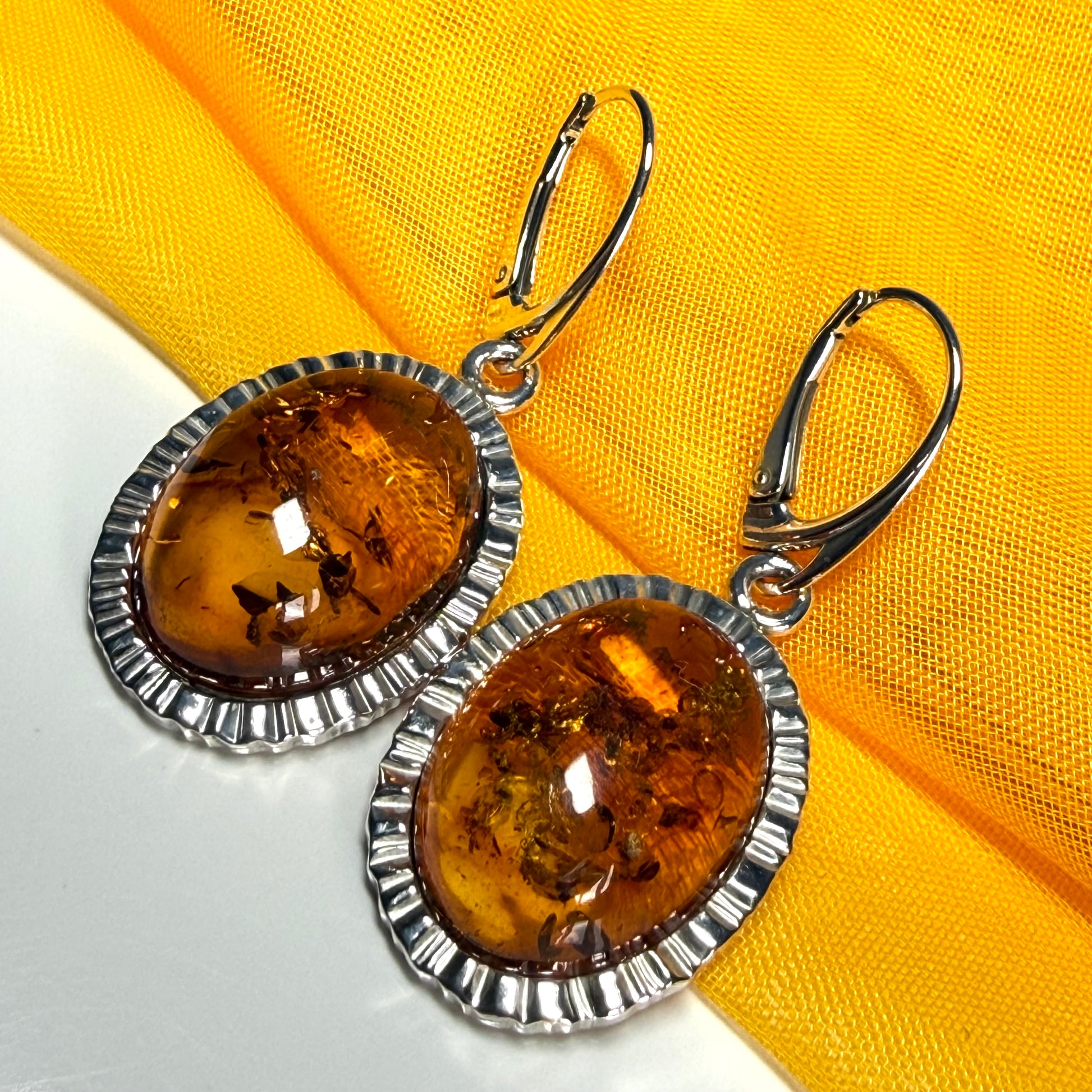 Pair of real amber drop earrings oval shaped sterling silver continental wire fittings