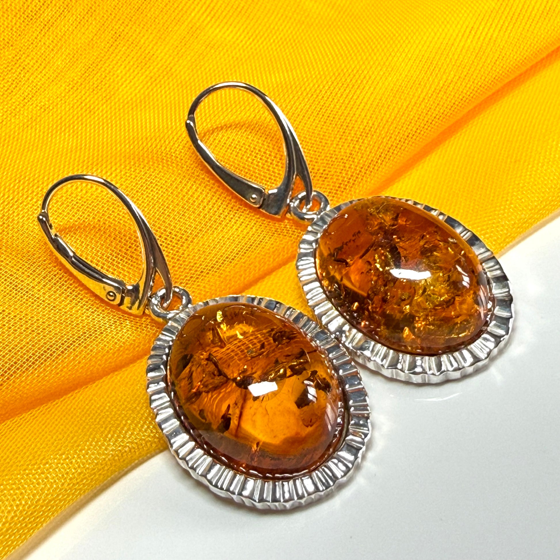 Pair of real amber drop earrings oval shaped sterling silver continental wire fittings