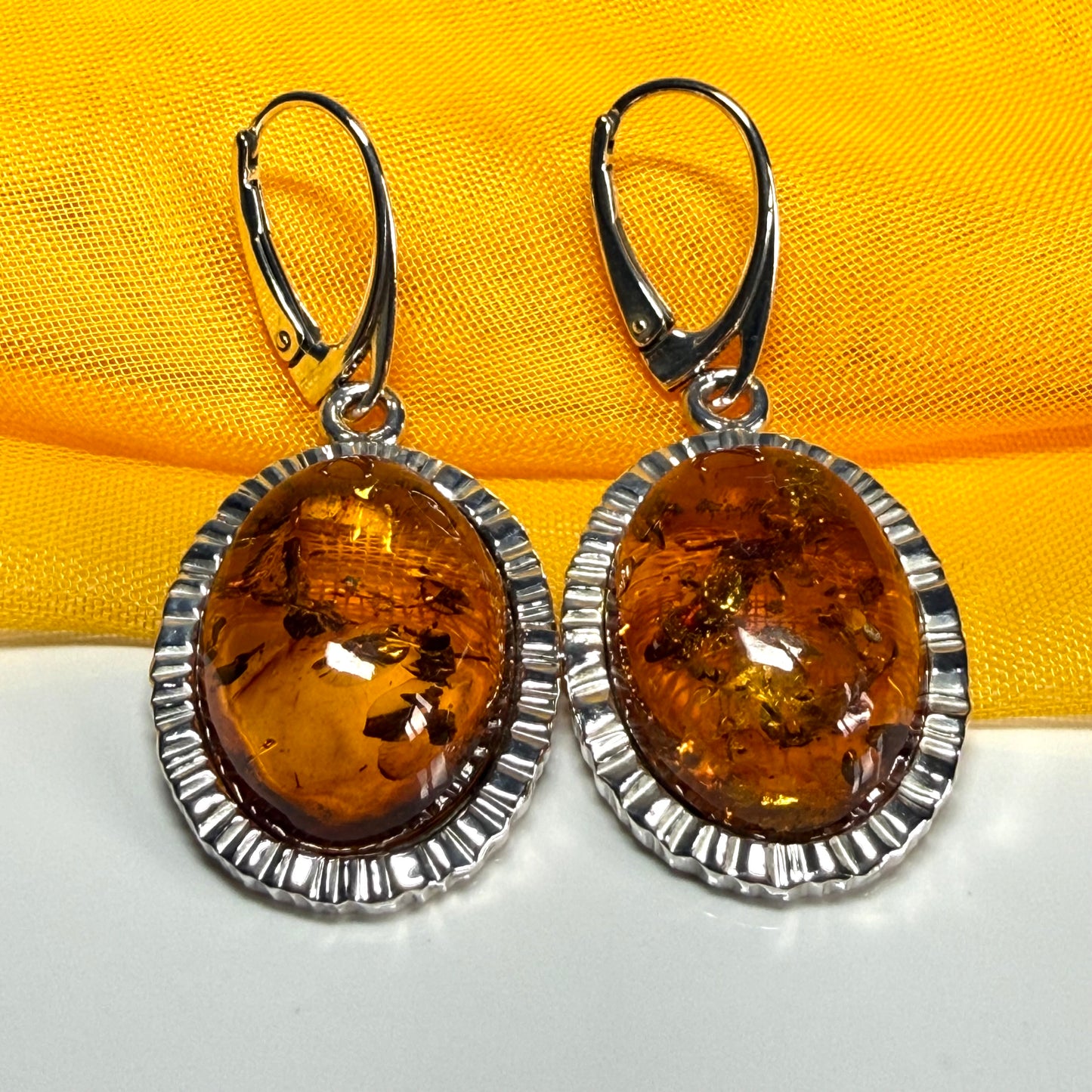 Pair of real amber drop earrings oval shaped sterling silver continental wire fittings