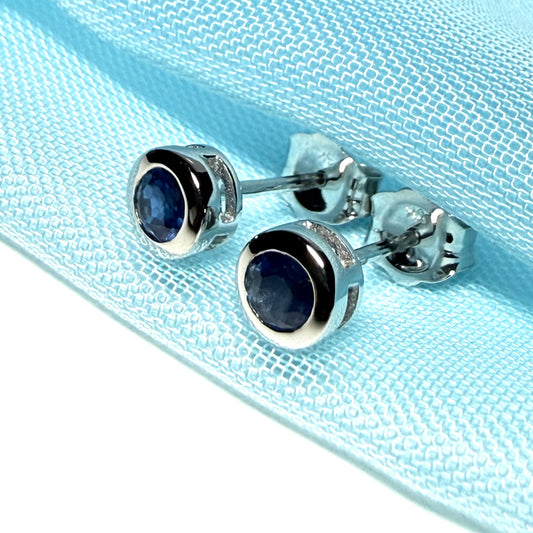 Pair of real blue sapphire earrings round white gold stud smooth rubbed over setting