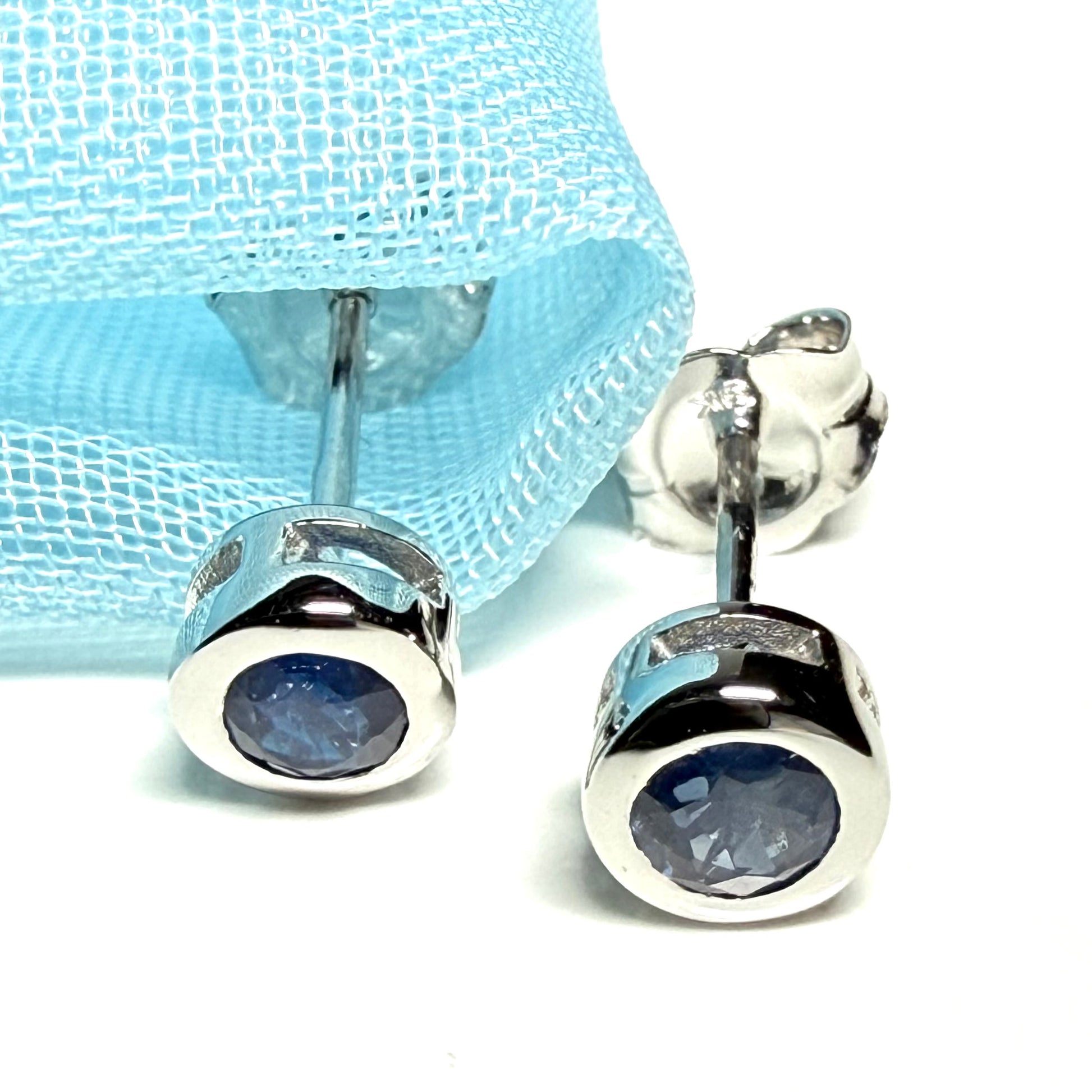 Pair of real blue sapphire earrings round white gold stud smooth rubbed over setting
