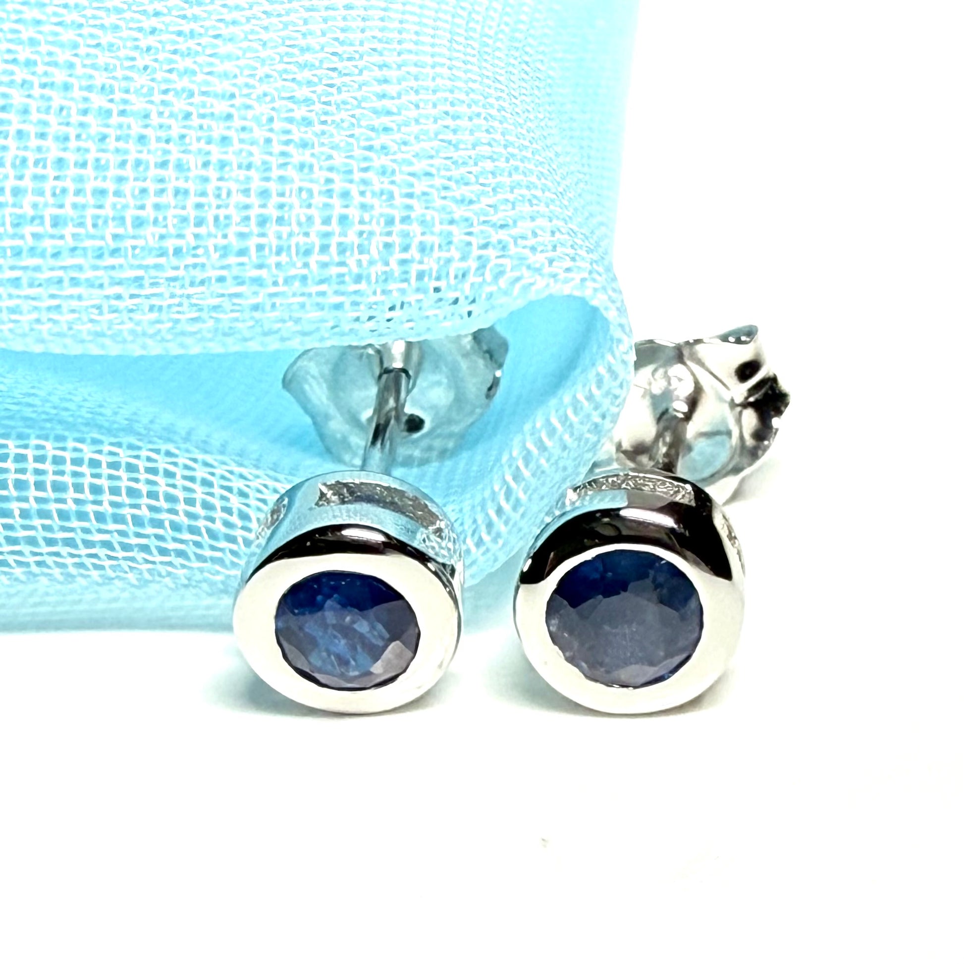 Pair of real blue sapphire earrings round white gold stud smooth rubbed over setting