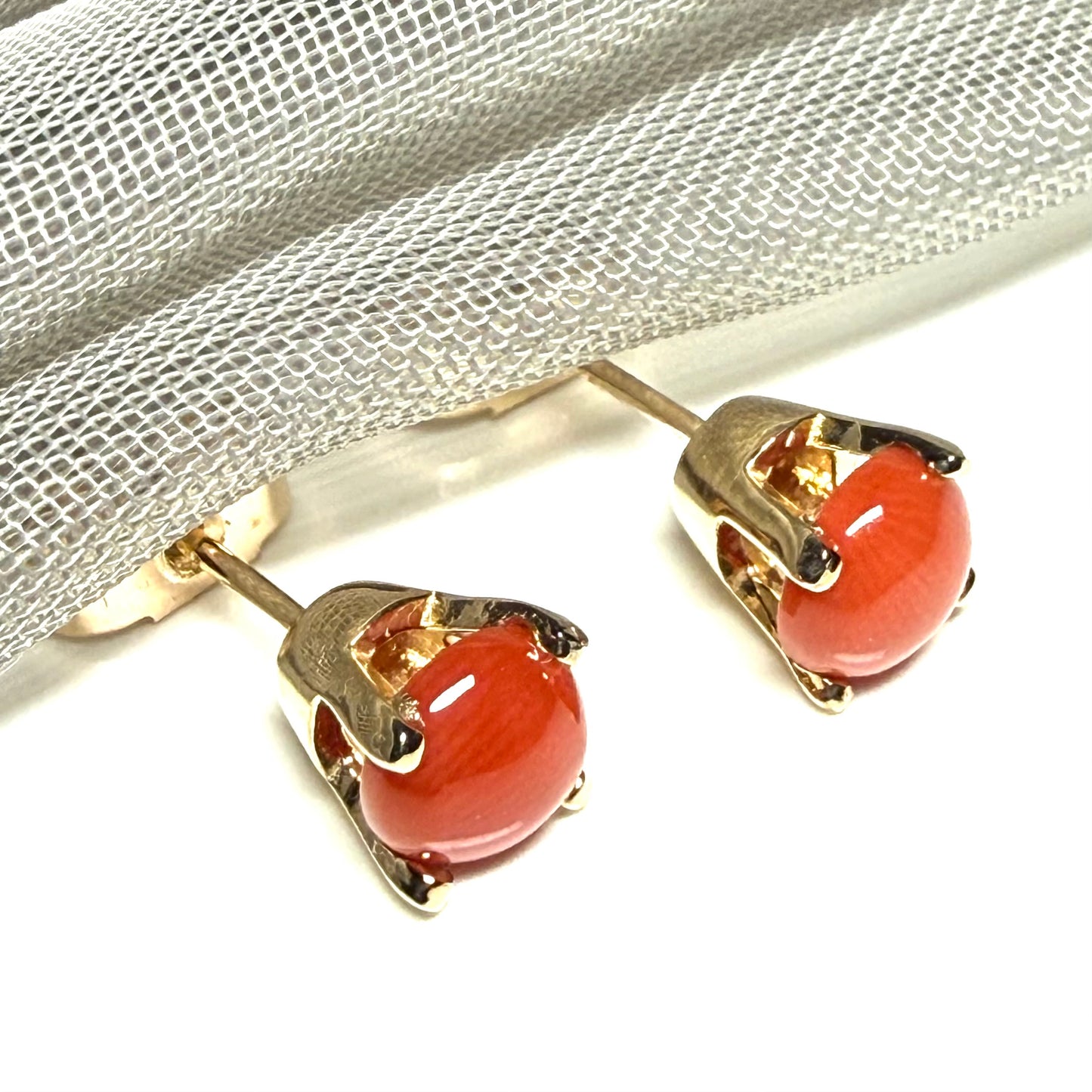 A pair of real dark coral yellow gold round clawed set stud earrings, simply gorgeous
