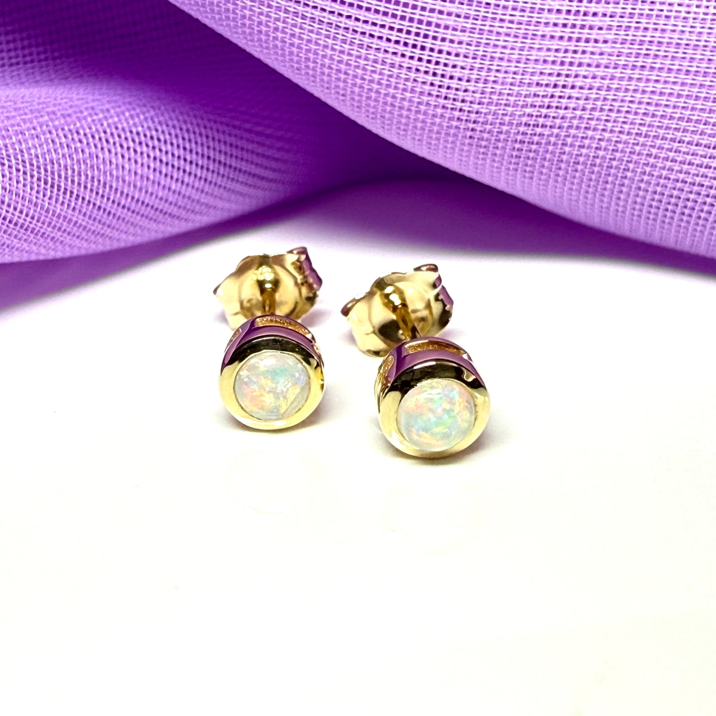 Pair of real opal earrings round yellow gold stud smooth rubbed over setting