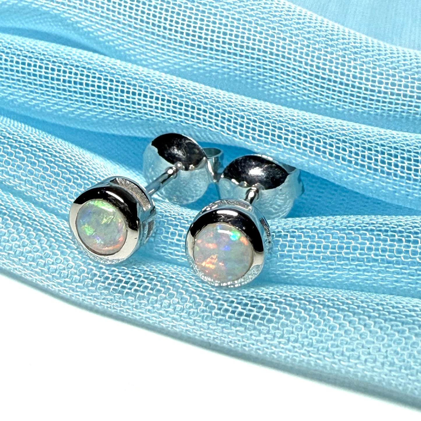 Pair of real opal earrings round white gold stud smooth rubbed over setting