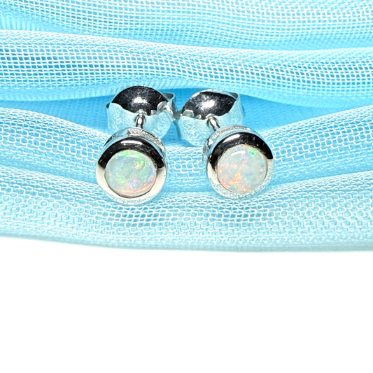 Pair of real opal earrings round white gold stud smooth rubbed over setting