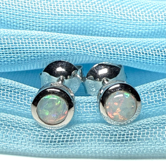 Pair of real opal earrings round white gold stud smooth rubbed over setting