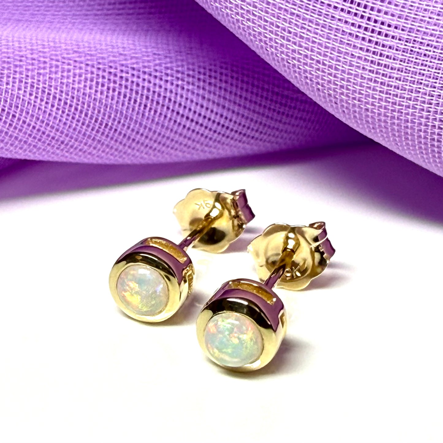Pair of real opal earrings round yellow gold stud smooth rubbed over setting