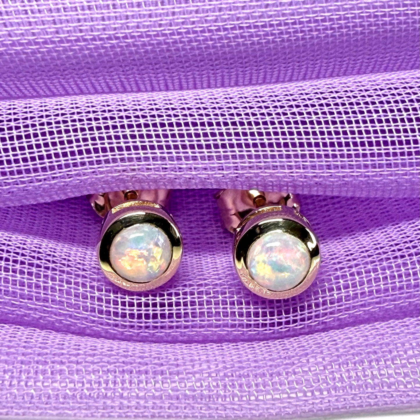 Pair of real opal earrings round yellow gold stud smooth rubbed over setting