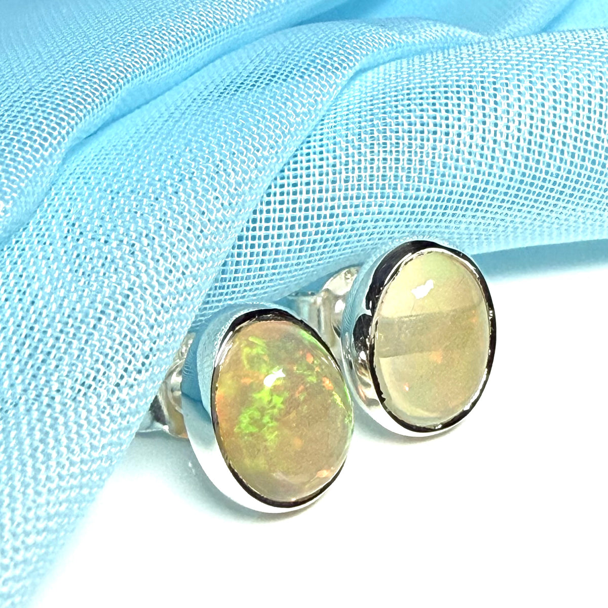 Real opal sterling silver oval shaped stud earrings