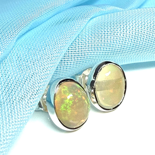Real opal sterling silver oval shaped stud earrings