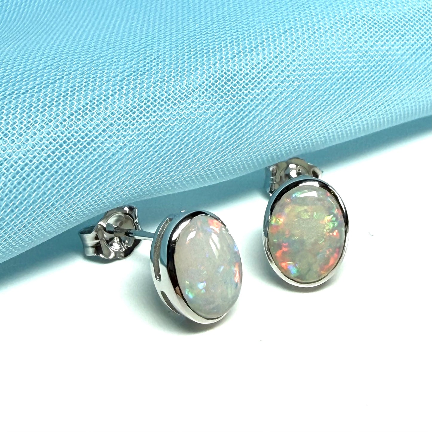 Pair of real opal white gold oval stud earrings