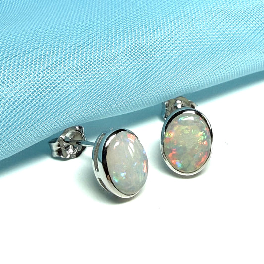 Pair of real opal white gold oval stud earrings