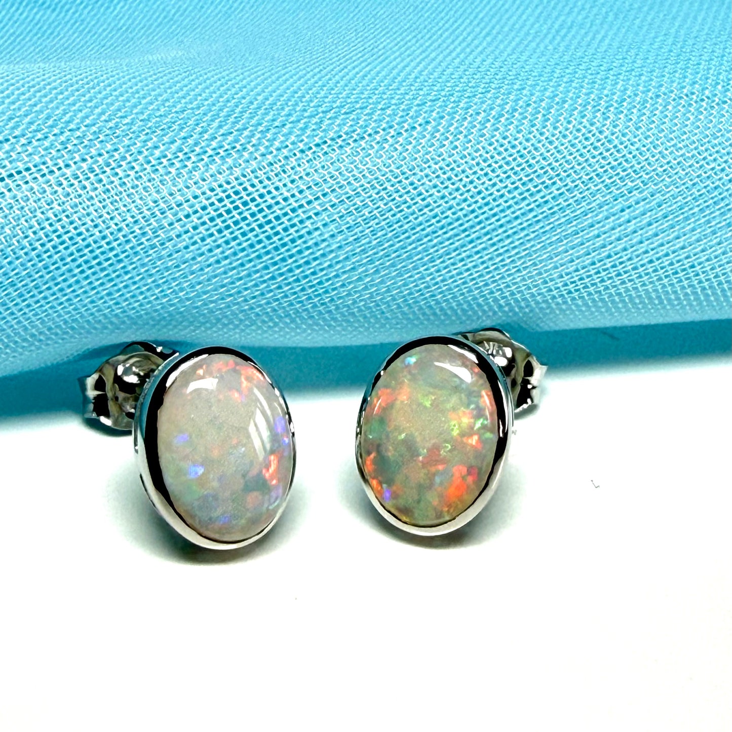 Pair of real opal white gold oval stud earrings