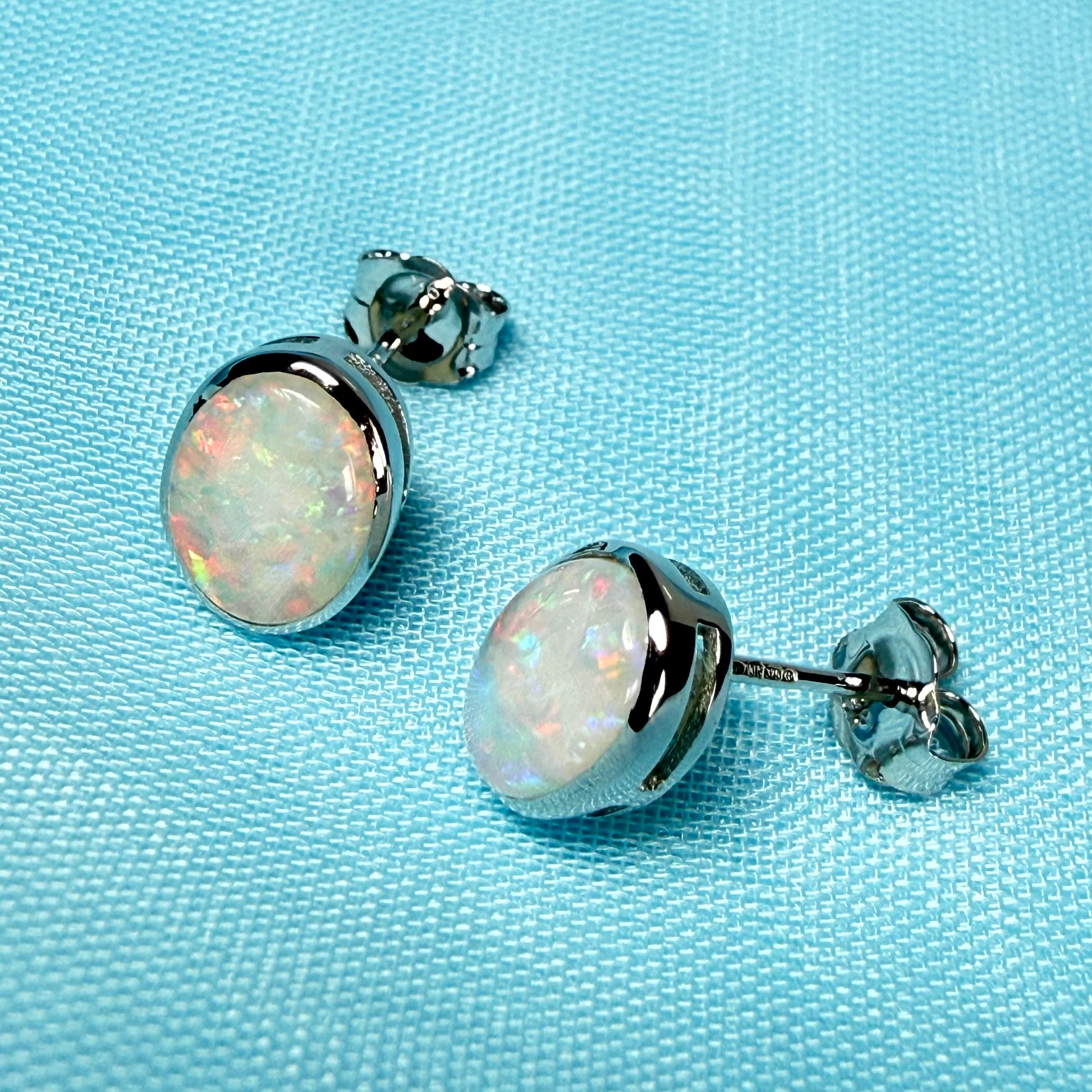 Pair of real opal white gold oval stud earrings
