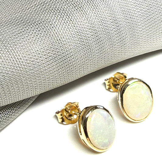 Pair of real opal yellow gold oval stud earrings