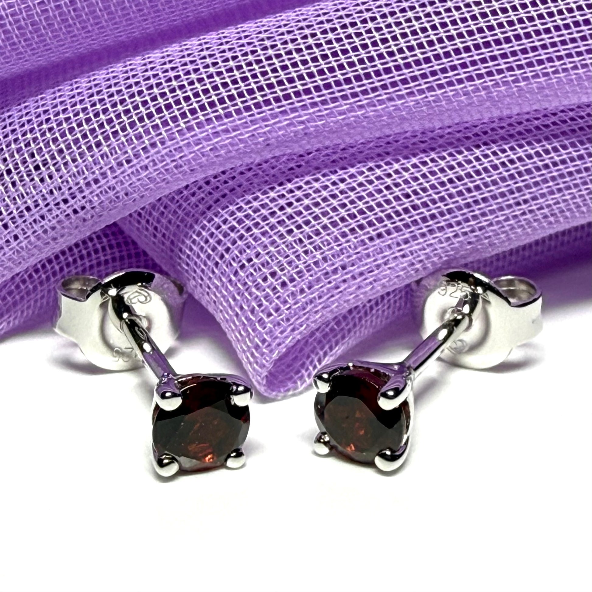 Pair of real red garnet silver round four claw stud earrings