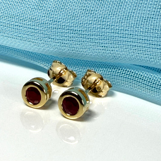 Pair of real red ruby earrings round yellow gold stud smooth rubbed over