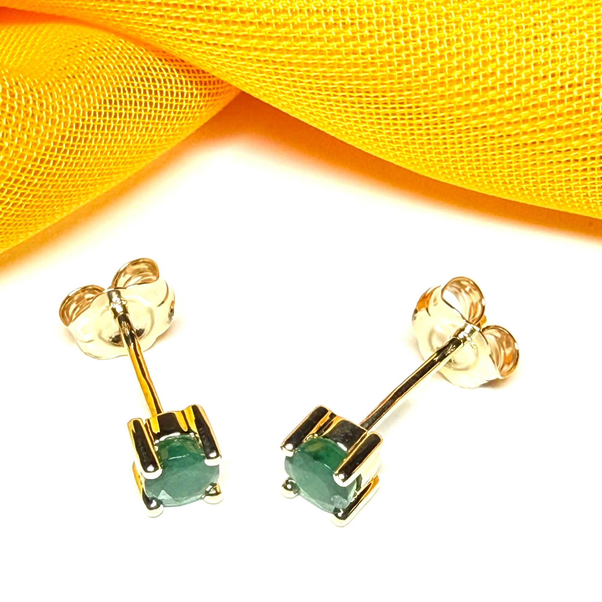 Pair of real ruby earrings round yellow gold claw set studs