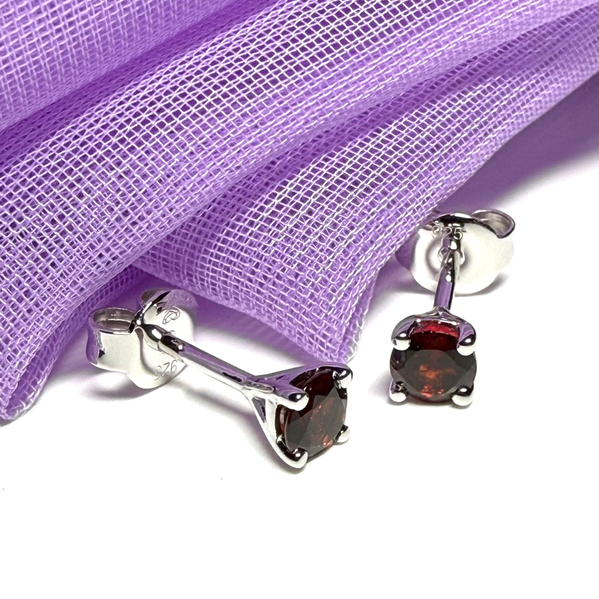 Pair of real red garnet silver round four claw stud earrings