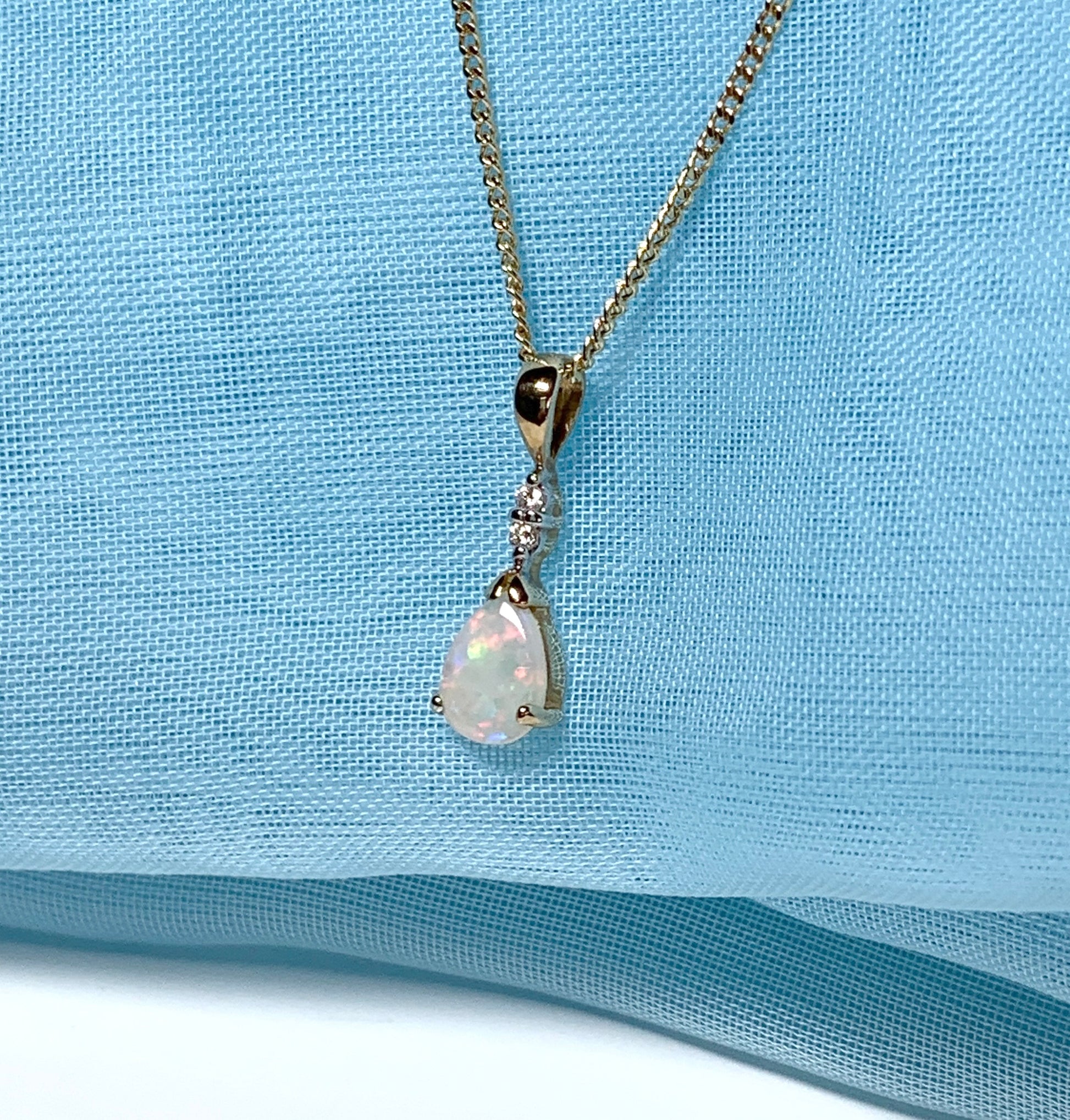 Pear shaped real opal and diamond yellow gold necklace