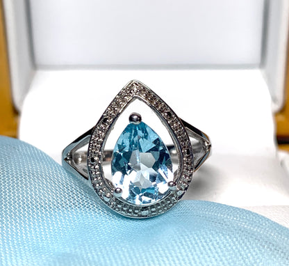 Pear shaped blue topaz sterling silver cluster ring