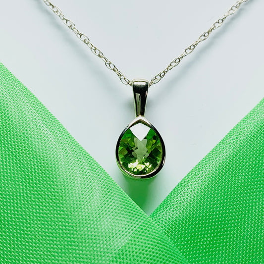 Pear peridot rubbed over yellow gold necklace