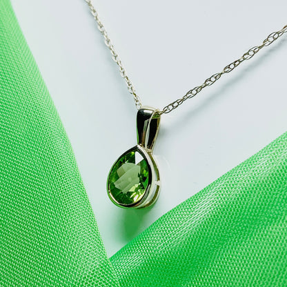 Pear peridot rubbed over yellow gold necklace