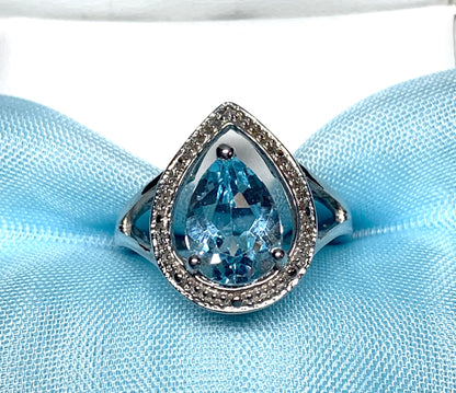 Pear shaped blue topaz sterling silver cluster ring