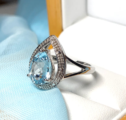 Pear shaped blue topaz sterling silver cluster ring