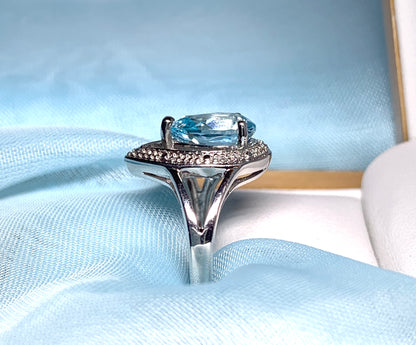 Pear shaped blue topaz sterling silver cluster ring