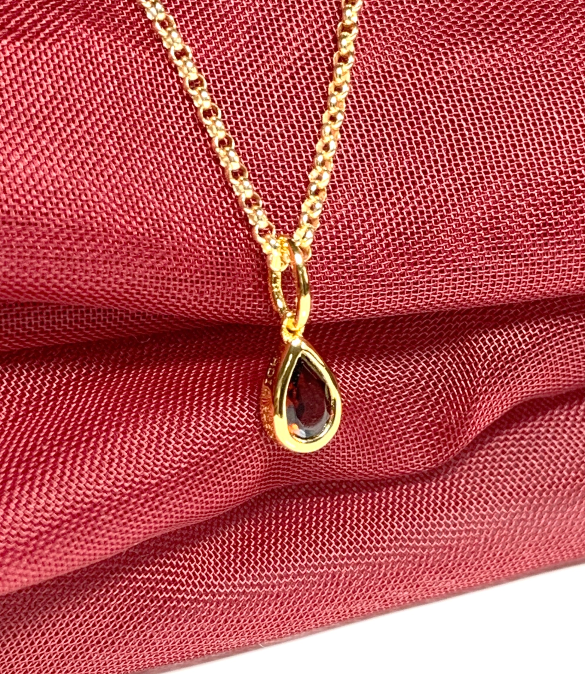 Pear shaped necklace set with a real red garnet stone sterling silver gilt including chain