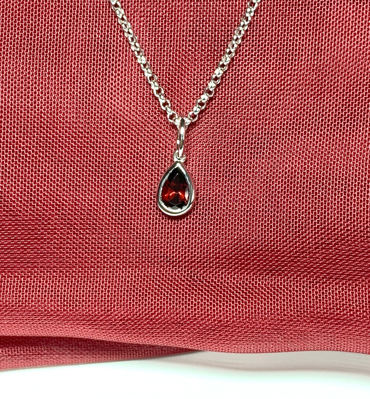 Pear shaped necklace set with a real red garnet stone sterling silver including chain